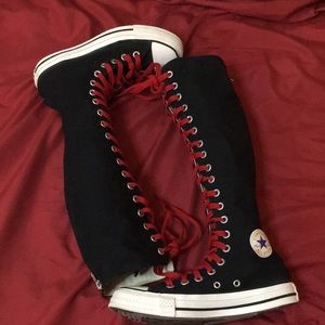 Knee high converse all star Chuck's with red laces